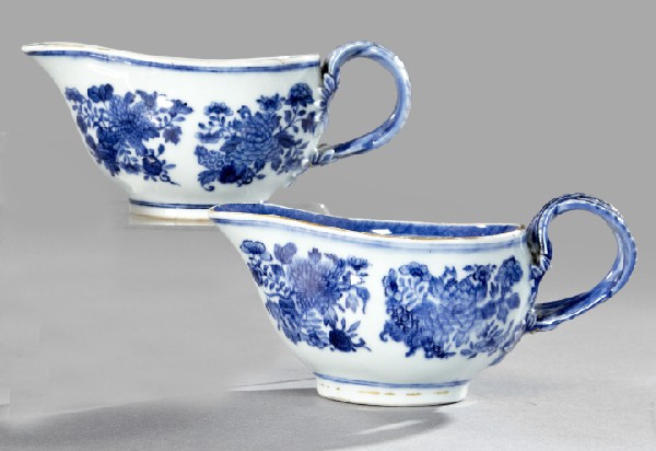 Chinese Export Porcelain Sauceboats: Pair of Chinese Export Blue and White Porcelain Sauceboats, ca. 1800, with double reeded handles, the exterior walls decorated with four equidistant underglaze blue floral reserves, h. 3-1/2", w. 3-1/