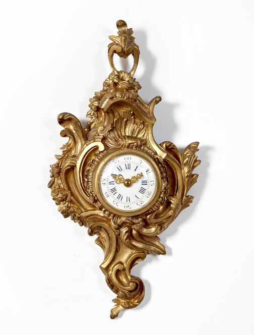 Diminutive French Gilt-Brass Wall Clock,: Diminutive French Gilt-Brass Wall Clock, fourth quarter 19th century, in the Louis XV style, the white enamel dial with blue Roman chapters and having a convex glass cover, h. 12-1/2", w. 6-1/2".