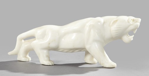 Japanese Meiji Carved White Marble Figure: Japanese Meiji Carved White Marble Figure of an Albino Tiger, fourth quarter 19th century, fitted with yellow glass taxidermy eyes, h. 4-7/8", w. 2-1/2", l. 13".