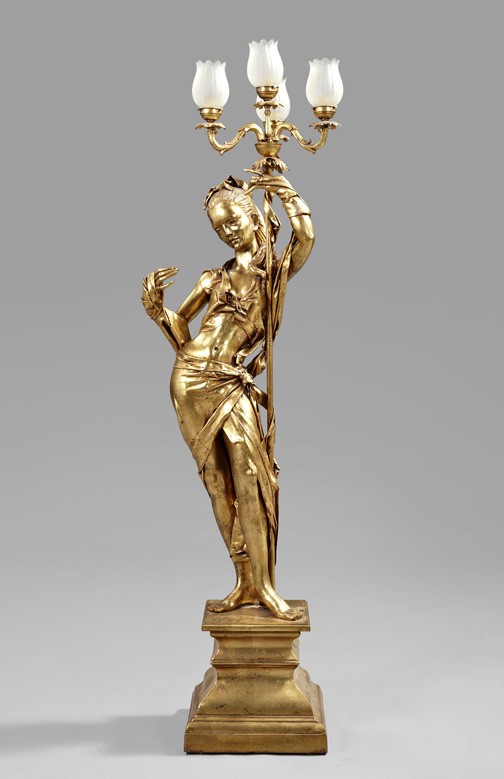 Dramatic Italian Gilded Papier-Mache Torchere: Dramatic Italian Gilded Papier-Mache Torchere, in the form of a nubile beauty holding a candelabrum-flambeau aloft, the candlearms fitted with four small electric lamps having tulip-form frosted glass