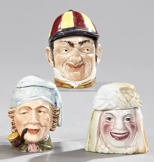 Group of Three Humidors,: Group of Three Humidors, fourth quarter 19th century, consisting of a French polychromed pottery "Cynical Jockey" example, probably Sarreguemines; a Continental pottery humidor in the form of a pipe-s