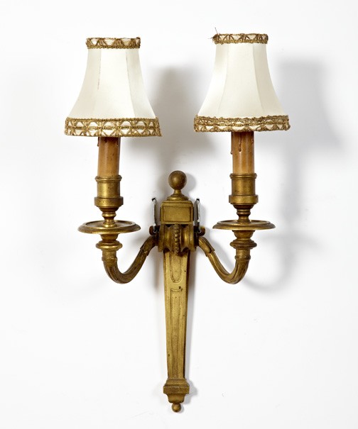 Attractive French Gilt-Brass Two-Light Applique: Attractive French Gilt-Brass Two-Light Applique, first quarter 20th century, in the late Louis XVI style, now electrified and fitted with a custom pair of small gilt lace-edged white satin shades, h. 
