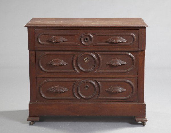 American Rococo Revival Walnut Dresser,: American Rococo Revival Walnut Dresser, third quarter 19th century, the front fitted with three graduated long drawers, each with racetrack moldings and carved pulls, h. 34-1/2", w. 40", d. 18-1/2".