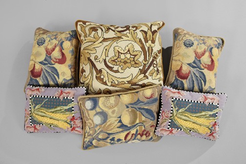 Collection of Six Needlepoint Sofa Pillows: Elegant Collection of Six Needlepoint Sofa Pillows, comprised of a trio of oblong "Fruits and Flowers" examples with taupe spiraled cording and velvet backs; a pair of smaller oblong examples featurin