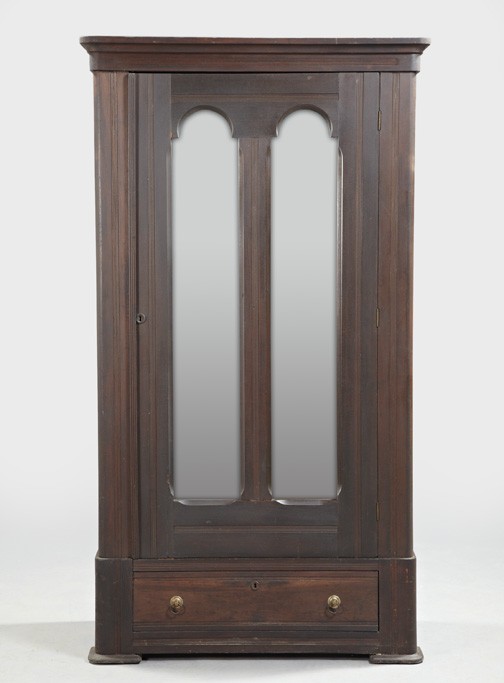American Eastlake Victorian Walnut Armoire,: American Eastlake Victorian Walnut Armoire, fourth quarter 19th century, the top with a simple crown molding above a single mirrored door, the base fitted with a single long drawer, h. 77-3/4", w. 43-