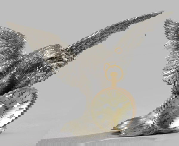 Achille Gamba Pewter Watch Stand,: Achille Gamba Pewter Watch Stand, in the form of a displayed eagle perched on a sphere and now fitted with an Italian antiqued brass-mounted pendant double convex-glazed watch/compass, the dial with b