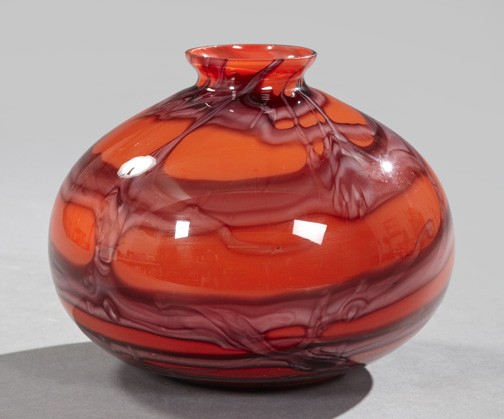 Dramatic Bohemian Glass Garniture Vase,: Dramatic Bohemian Glass Garniture Vase, of modified cushion form in an abstracted vine pattern in orange and shaded claret, the base with a partial glassmaker's stencil in silver and the paper label o