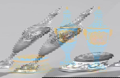 Three-Piece Group of Continental Porcelain,: Three-Piece Group of Continental Porcelain, comprising an attractive pair of Carl Thieme, Potschappel, hand-painted porcelain covered masque-handled garniture vases with periwinkle blue grounds in the