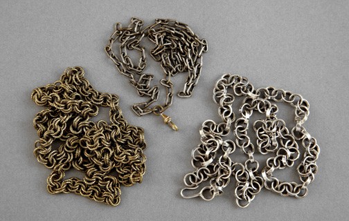 Collection of Three Antique American Chains,: Collection of Three Antique American Chains, composed of a silverplated brass box-link example with a pendant clip, first quarter 20th century, l. 27"; a longer gilt-brass double-link chain, fourth qu