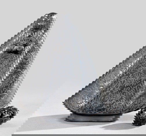 Two-Piece Group of Mexican Pottery: Two-Piece Group of Mexican Black Smoke-Glazed Pottery, second quarter 20th century, consisting of a figure of an elaborately robed Virgin Mary holding a five-point star in her hands, h. 9", w. 7-1/2",