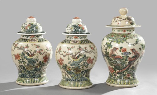 Kuang Hsu Polychromed Porcelain Garniture: Three-Piece Kuang Hsu Crackle-Glazed and Polychromed Porcelain Garniture, first quarter 20th century, of "Temple Jar" form, comprised of a pair of "Songbirds and Flowering Shrubs"-decorated vases, h. 