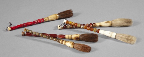 Decorative Chinese Calligraphy Brushes: Group of Five Decorative Chinese Calligraphy Brushes, the handles in coral, agate and serpentine with bone tops and horsehair bristles, l. 10" to 11-3/4".
