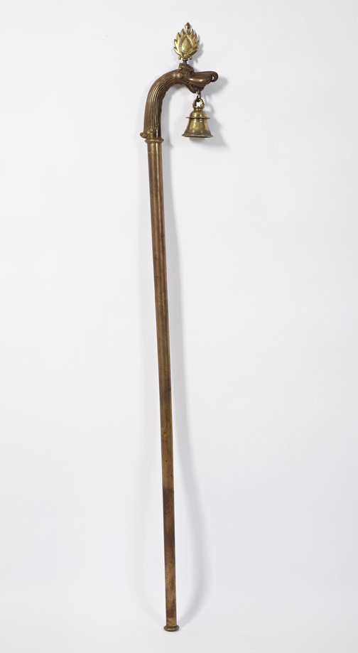 Nepalese Bronzed Processional Staff: Nepalese Bronzed Cast-Iron and Gilt-Brass Vaga-Headed Processional Staff, fourth quarter 19th century, fitted with a pendant bell, l. 62".