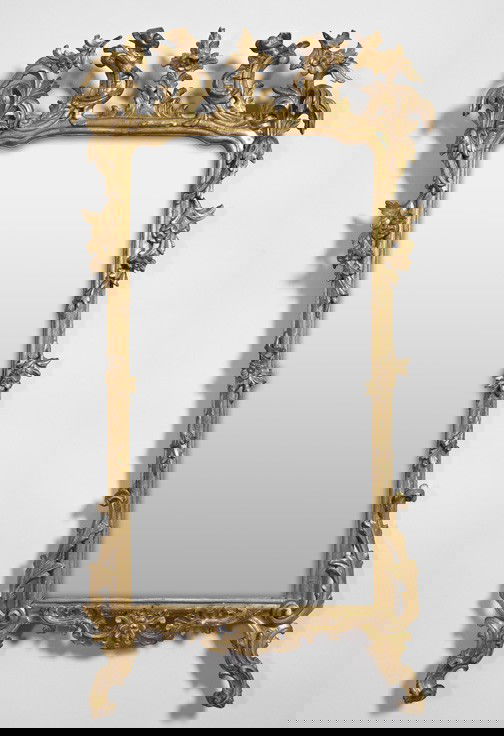 Northern Italian Carved Giltwood Looking Glass: Northern Italian Carved Giltwood Looking Glass, fourth quarter 18th century and later, in the rococo style, the frame with spiral-wrapped floral garlands and a leafed crest rail, retains the tastefull