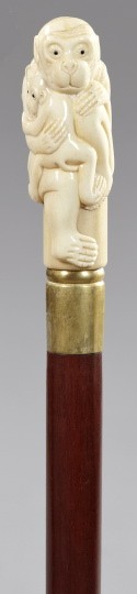 Japanese Meiji Export Mahogany Walking Stick: Japanese Meiji Export Brass-Mounted Mahogany Walking Stick, first quarter 20th century, with a carved ivory grip in the form of a seated monkey clutching her baby, l. 35".