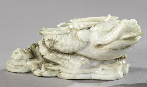 Kuang Hsu Jade Figure of a Feng Shui Money Toad: Kuang Hsu Carved Jade Figure of a Feng Shui "Money Toad", first quarter 20th century, the jade in pale green and white, h. 4", w. 6", l. 9".