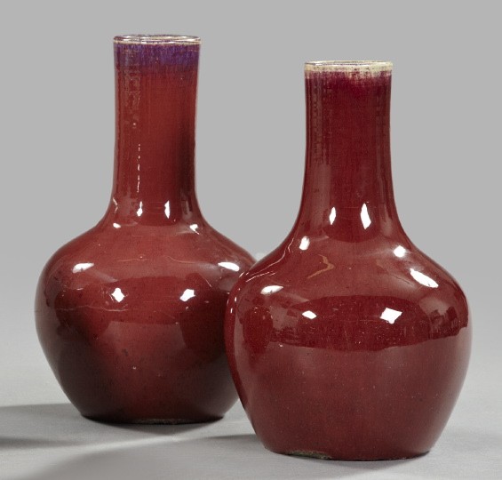 Tao Kuang "Sang De Boeuf" Porcelain Vases: Near Pair of Tao Kuang "Sang De Boeuf" Porcelain Tall-Neck Vases, second quarter 19th century, in the traditional style, h. 12-1/4", dia. 7-1/2".