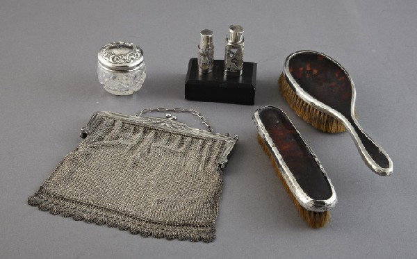 Six-Piece Group of Silver Toilette Items,: Six-Piece Group of Silver Toilette Items, consisting of an elegant two-piece Mappin and Webb, London, sterling silver-mounted tortoiseshell toilette service, comprised of an oval lady's hair brush and