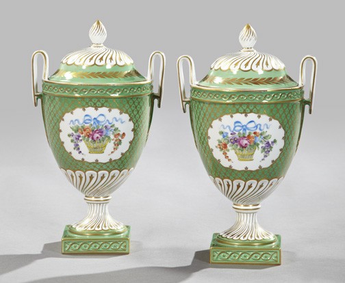 Pair of Potschappel Porcelain Garniture Vases: Pair of Potschappel Porcelain Covered Two-Handled Garniture Vases, first quarter 20th century, having lattice-gilded green grounds in neoclassical "Dresden" decor, each facade with a well-painted rese