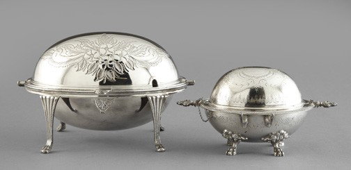 Group of Two Silver Roll-Top Servers,: Group of Two Silver Roll-Top Servers, one an Edwardian silverplate oval roll-top bacon server with paw feet, in "Repousse" floral sprays, first quarter 20th century, h. 7", w. 11", d. 8"; and the othe