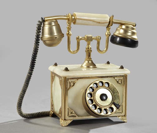 Gilt-Brass and Onyx Telephone: French Gilt-Brass and Black Bakelite-Mounted White Onyx Telephone, fourth quarter 20th century, of the traditional type, fitted with a rotary dial and double gilt-brass ringer bells, h. 10-1/4", w. 6-