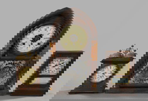 Good Three-Piece Group of Mantel Clocks,: Good Three-Piece Group of Mantel Clocks, comprised of a Waterbury Clock Company mahogany-veneered lancet-arched mantel clock, third quarter 19th century, the lower door with silvered reverse-glass ste