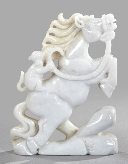 Kuang Hsu Carved Jade Figure of a Monkey,: Kuang Hsu Carved Jade Figure of a Monkey, first quarter 20th century, carved from pale gray-white stone, the primate depicted astride a rearing horse standing on a crag, h. 5-3/4", w. 3-3/4".