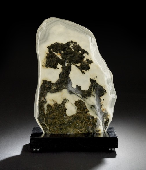 Chinese Scholar's Gazing Stone and Stand: Chinese Two-Color Scholar's Gazing Stone and Stand, the layered stone polished to reveal the dark brown figure of a Chinese oak tree on rockwork against a gray/white stone, presented on a wooden stand