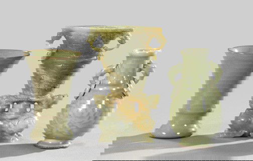 Group of Three Chinese Decorative Objects,: Group of Three Chinese Decorative Objects, first quarter 20th century, consisting of a Kuang Hsu carved green and ivory soapstone ringed two-handled vase on an addorsed kylin base; a Kuang Hsu dark ce