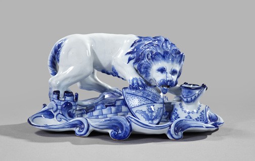 Emile Galle Blue and White Pottery Encrier: Fine and Rare Emile Galle Blue and White Pottery Encrier, modeled as an armorial lion flanked by a knight's helmet and a crenellated tower as ink bottle wells, all surmounting a serpentine-edged integ