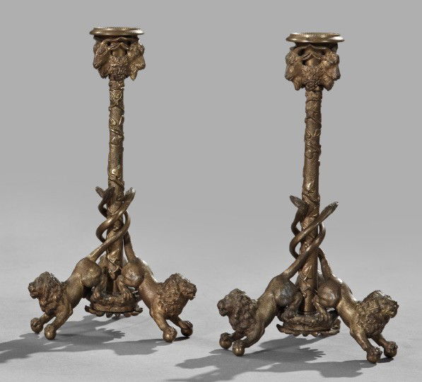 Continental Patinated Bronze Candlesticks: Unusual Pair of Continental Patinated Bronze Candlesticks, fourth quarter 19th century, each of triple lion-footed form, each fitted with a later glass bobeche, h. 8-3/4", dia. 4-3/4".