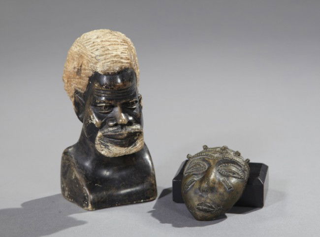Group of Two African Decorative Objects,: Group of Two African Decorative Objects, 20th century, consisting of a carved stone bust of an elder male, h. 6-1/2", w. 3-1/4", d. 3-1/4"; and a miniature brass face mask, h. 3-1/2", w. 2-3/8".