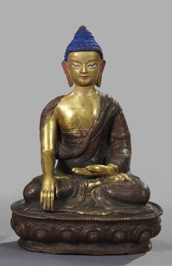 Nepalese Patinated and Parcel-Gilt Bronze Buddha: Nepalese Patinated and Parcel-Gilt Bronze Figure of Buddha, third quarter 19th century, the figure depicted seated in the lotus position, with matte blue enamel details, h. 7-3/4", w. 5-1/2", d. 4".