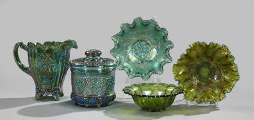 Five-Piece Collection of Green Carnival Glass: Five-Piece Collection of Green Carnival Glass, late 20th century, consisting of a "Grape and Cable"-embossed lidded biscuit jar; an iced beverage pitcher with a floral design; and three condiment bowl