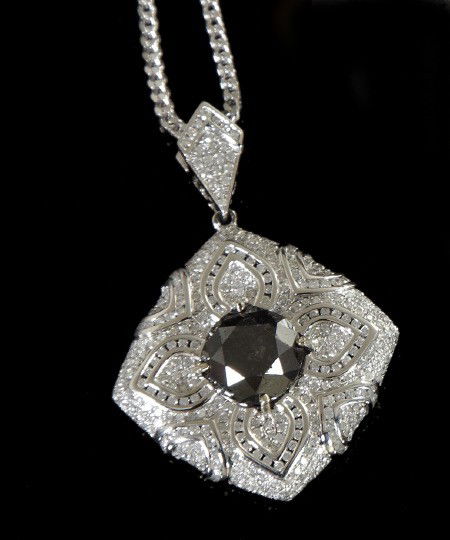 Gold and Black and White Diamond Pendant: Impressive Fourteen-Karat White Gold and Black and White Diamond Pendant, featuring a round brilliant-cut black diamond, weighing approximately 8.36 carats, set within an elaborate stylized pave- and