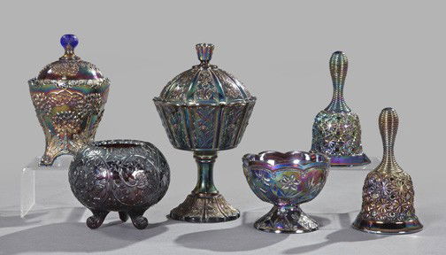 Collection of Iridescent Purple Carnival Glass: Six-Piece Collection of Iridescent Purple Carnival Glass, late 20th century, consisting of a bud vase; a circular footed compote; a pair of dinner bells; a covered and footed jar; and a circular cover