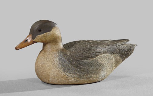 William Young (American, 1922-2008),: William Young (American, 1922-2008), a carved, polychromed and stained wooden decoy of an American Black Duck, 1981, the head fitted with glass eyes, the base signed "Wm.Young/1981/#3", h. 5-1/2", w. 
