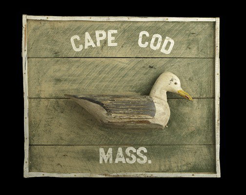 Large Carved and Painted American Wooden Sign: Large Carved and Painted American Wooden Sign, for Cape Cod, Massachusetts, crafted of weathered barn wood and featuring a large wooden decoy of a seagull, in the American style, h. 29-1/2", w. 36".