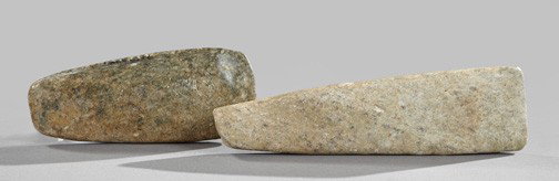 Two Rare Archaic Chinese Jade Axe Heads,: Two Rare Archaic Chinese Jade Axe Heads, Neolithic period, second-first millenium B.C., the first a flecked black jade example of tapered ovoid form with rounded edges, l. 6-1/2"; and the second a lig