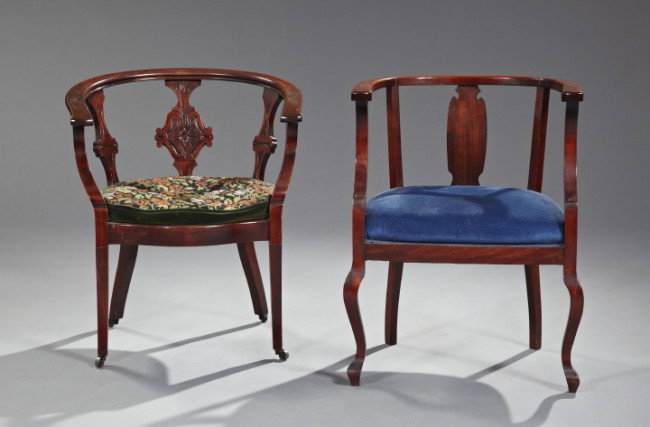Victorian Mahogany-Stained Birch Bucket Chairs: Two Late Victorian Mahogany-Stained Birch Bucket Chairs, fourth quarter 19th century, each with a curved crest above three splats, joined to the padded seat (one with a needlepoint cushion seat) by un