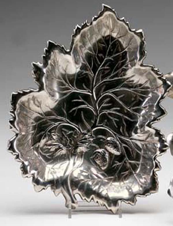 WALLACE STERLING SILVER DISH: American Sterling Silver Strawberry Dish, mid-20th century, by Wallace Silversmiths, Wallingford, Connecticut; in the form of a strawberry leaf, embossed with veining and a strawberry cluster, l. 11".