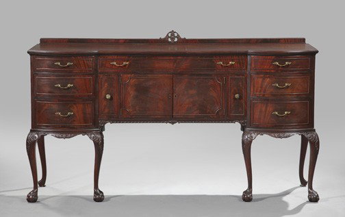 George III-Style Mahogany Sideboard,: George III-Style Mahogany Sideboard, second quarter 20th century, the molded cornice centered by a pierced quatrefoil carving, above a top with rounded projecting ends, over a conforming case fitted w