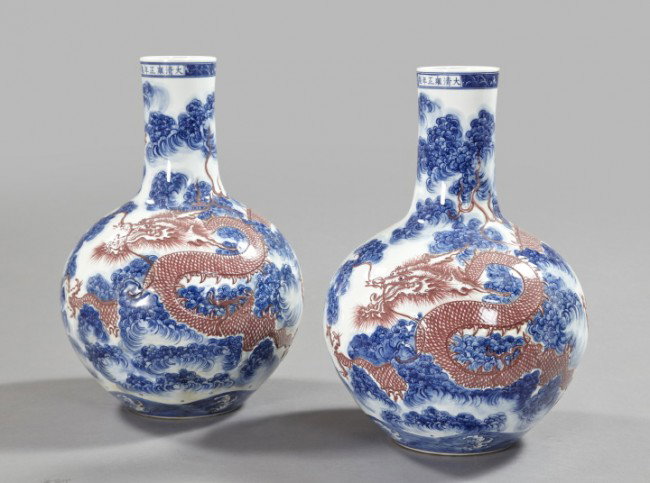 Kuang Hsu Porcelain Garniture Vases: Imposing Pair of Kuang Hsu Blue and White Porcelain Garniture Vases, fourth quarter 19th century, of tall-neck globular form, each with "rose ombre"-glazed bas-relief ornament of "Celestial Dragons an