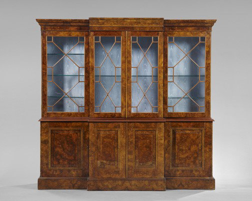 Regency-Style Mahogany and Burl Bookcase: Regency-Style Mahogany and Burl Breakfront Bookcase, the ogee-molded cornice above a case fitted with four astragal-glazed doors, the lower section fitted with four inset doors, each with a raised pan