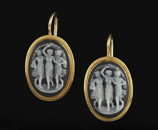 Yellow Gold and Onyx Cameo Earrings: Pair of Victorian-Style Eighteen-Karat Yellow Gold and Onyx Cameo Earrings, each of oval outline with a bezel-set onyx cameo in black and white stone depicting the "Three Graces".