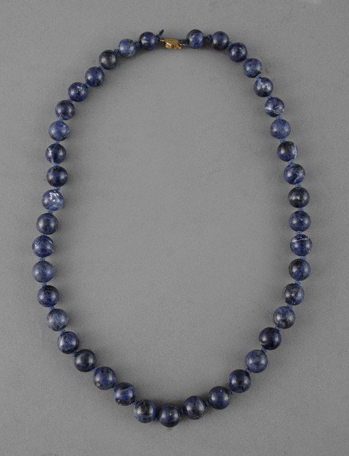 Single Strand of Lapis Lazuli Beads,: Single Strand of Lapis Lazuli Beads, strung slightly graduated, the circular beads of mottled blue lapis lazuli with scattered white inclusions, l. 12".