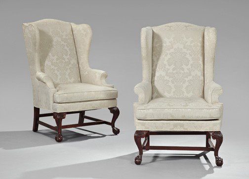 Pair of George III-Style Mahogany Wing Chairs: Pair of George III-Style Mahogany Wing Chairs, late 20th century, each covered in ivory damask and raised on ball-and-claw feet, h. 47-1/2", w. 31-1/4", d. 34-1/2".
