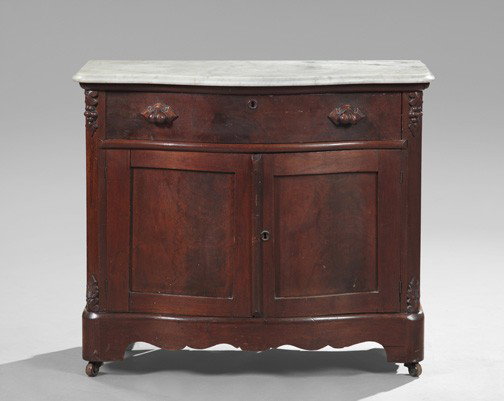 American Walnut and Marble-Top Washstand: American Rococo Revival Walnut and Marble-Top Washstand, third quarter 19th century, having a serpentine white marble top above a single long drawer and a pair of cabinets below, h. 31", w. 35-1/2", d