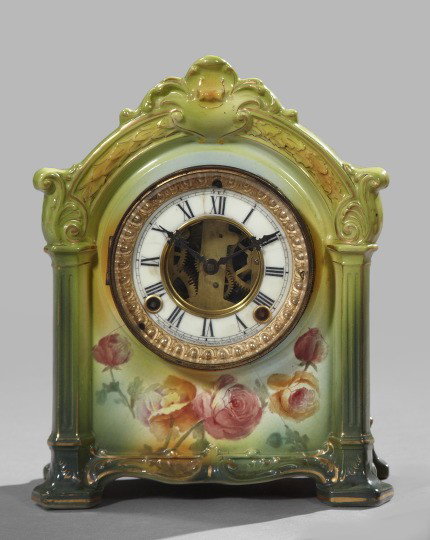 Ansonia Porcelain Mantel Clock,: Ansonia Porcelain Mantel Clock, early 20th century, the case marked Royal Berlin, Germany, in floral decor on a shaded green ground, the face and works labeled "Ansonia", h. 11-1/2", w. 9", d. 5".