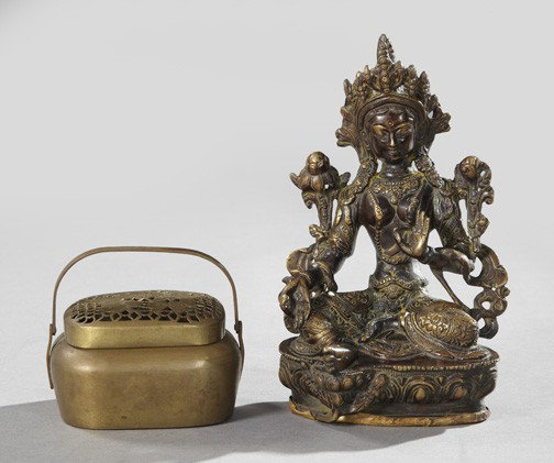 Group of Two Oriental Metal Objects,: Group of Two Oriental Metal Objects, consisting of a Nepalese patinated bronze figure of an elaborately garbed seated youthful Buddha, fourth quarter 19th century, h. 8-3/8", w. 5-1/2", d. 4-1/2"; and